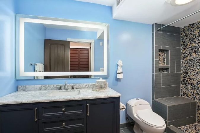 A Kitchen With A Sink And A Window