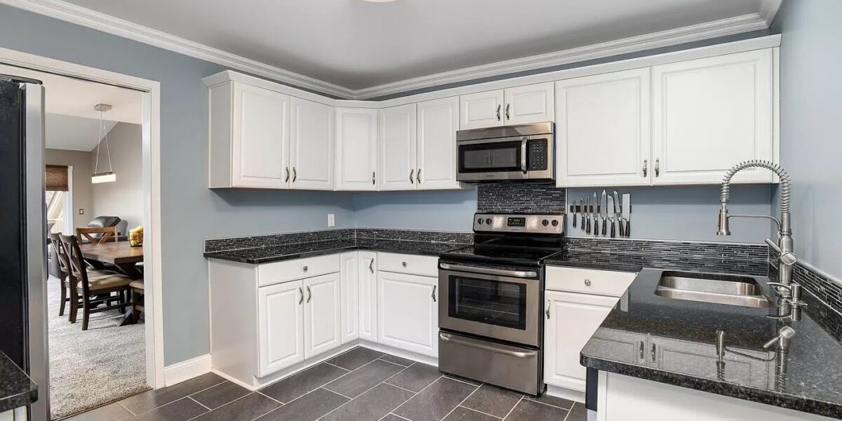A Kitchen With A Stove Top Oven