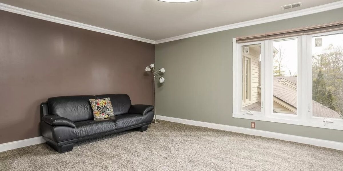 A Bedroom With A Large Window