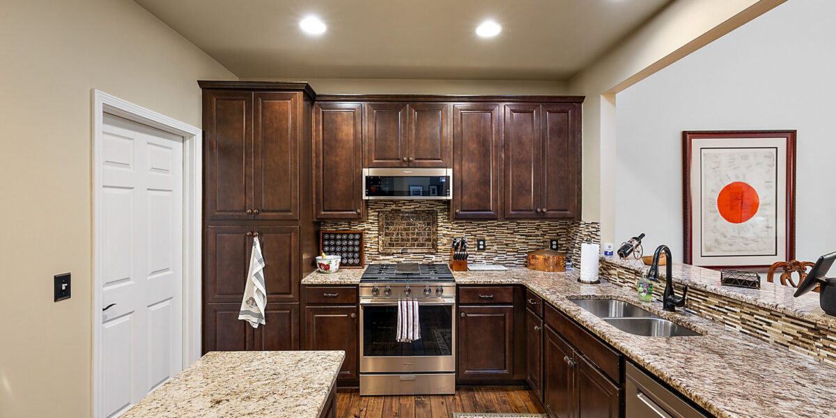 A Modern Kitchen With Stainless Steel Appliances