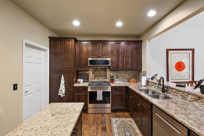 A Modern Kitchen With Stainless Steel Appliances