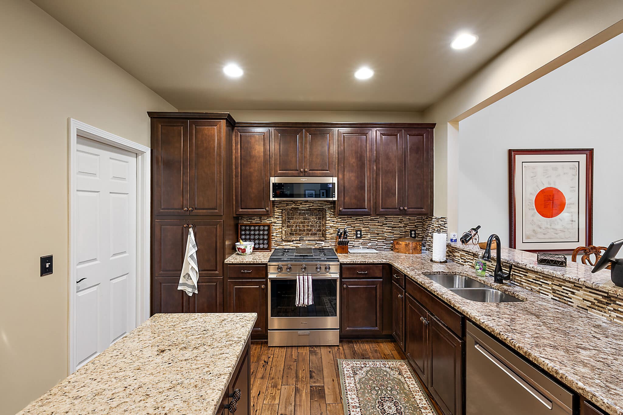 a modern kitchen with stainless steel appliances