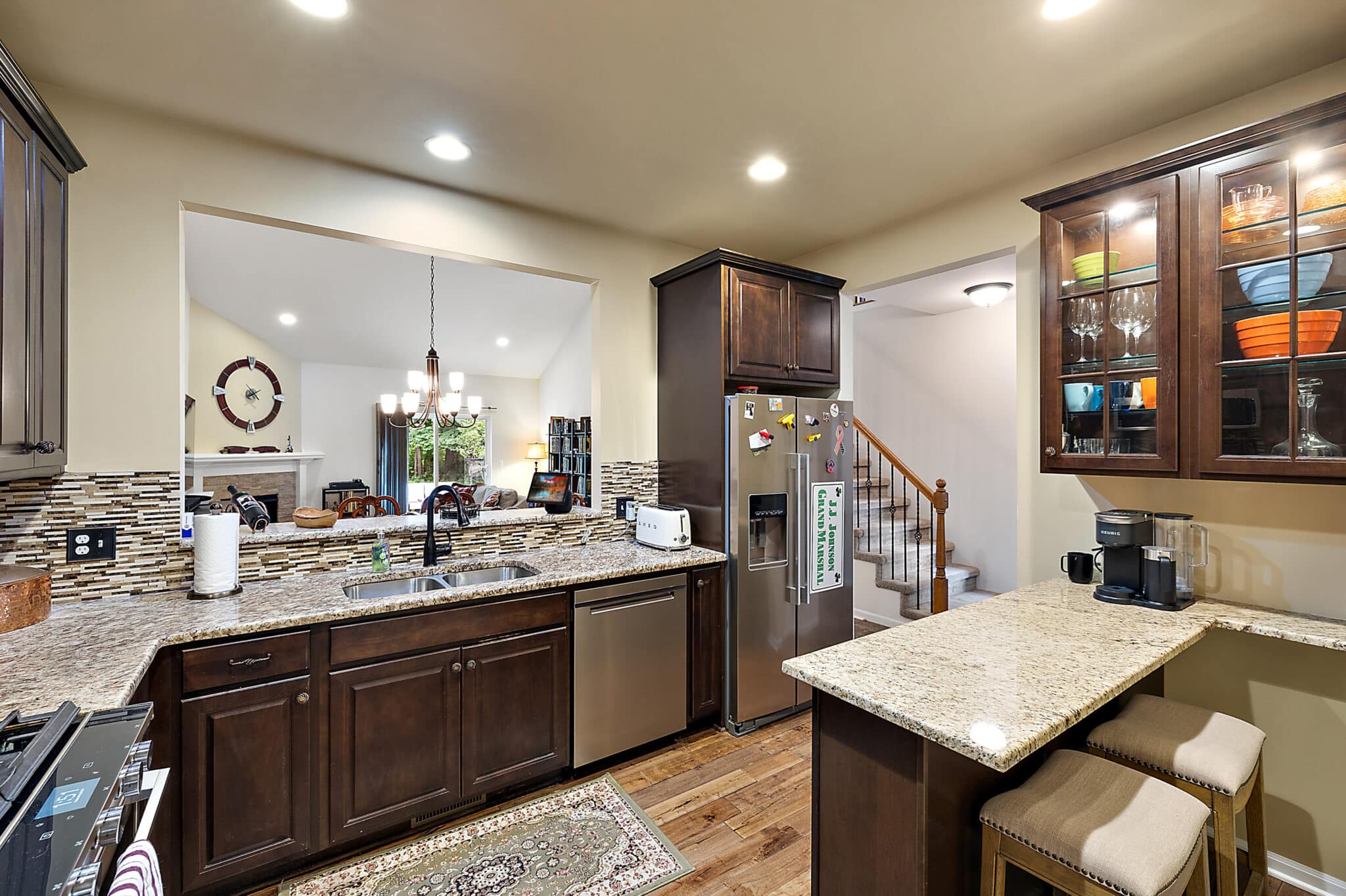 a modern kitchen with an island in the middle of a room