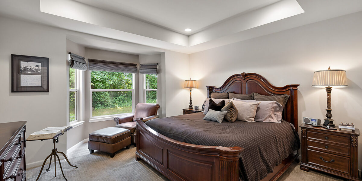 A Living Room Filled With Furniture And A Bed