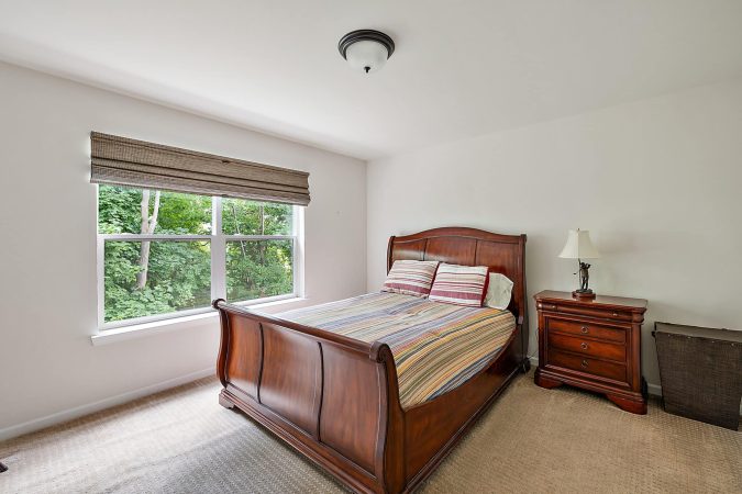 A Bedroom With A Bed In A Room