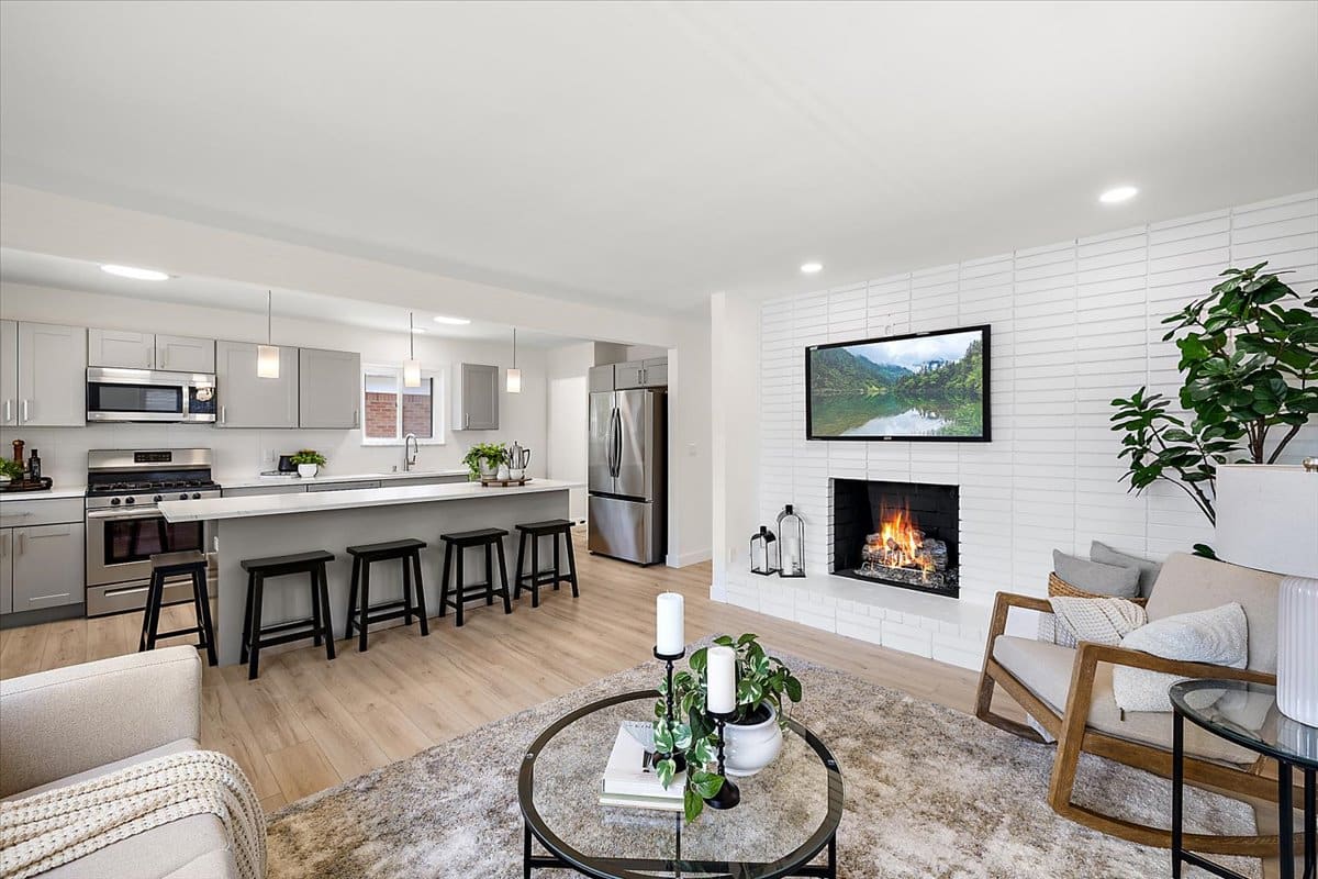 a living room filled with furniture and a fire place