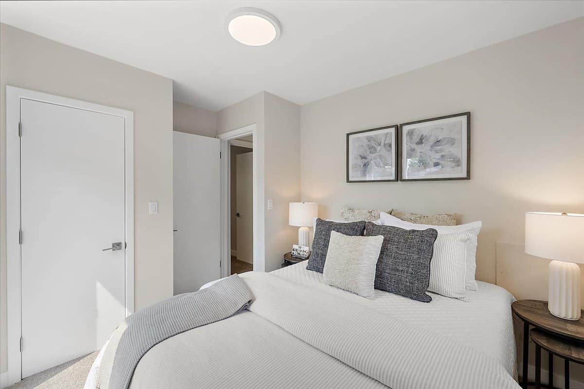 a bedroom with a large bed in a hotel room