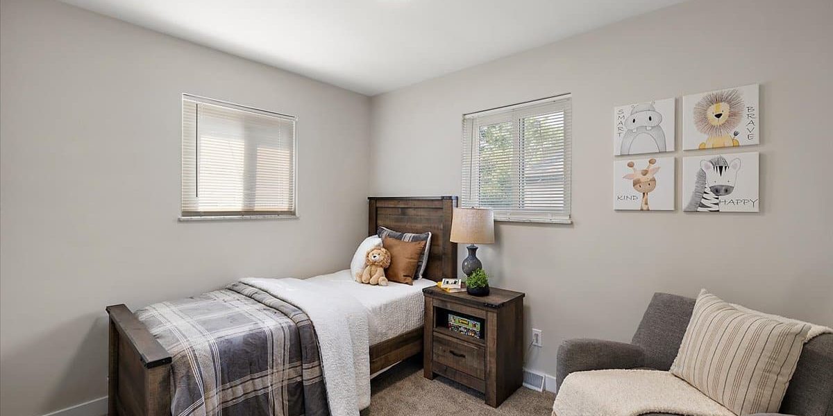 A Bedroom With A Bed And A Couch In A Living Room