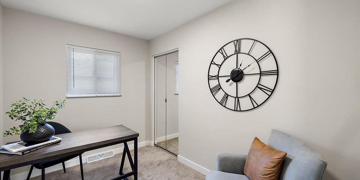 A Living Room Filled With Furniture And A Flat Screen Tv