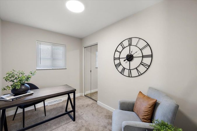 A Living Room Filled With Furniture And A Flat Screen Tv