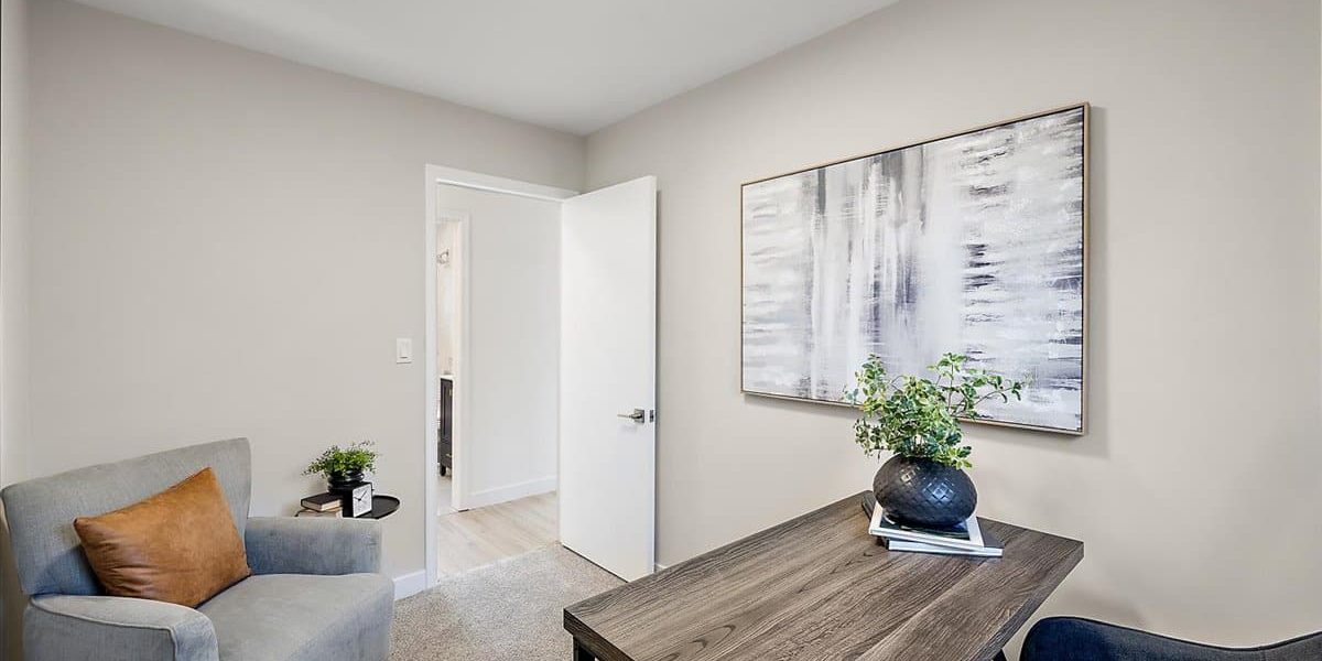A Living Room Filled With Furniture And A Flat Screen Tv