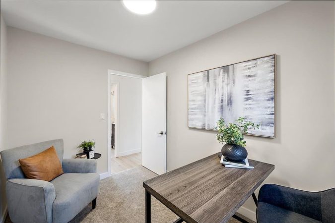 A Living Room Filled With Furniture And A Flat Screen Tv