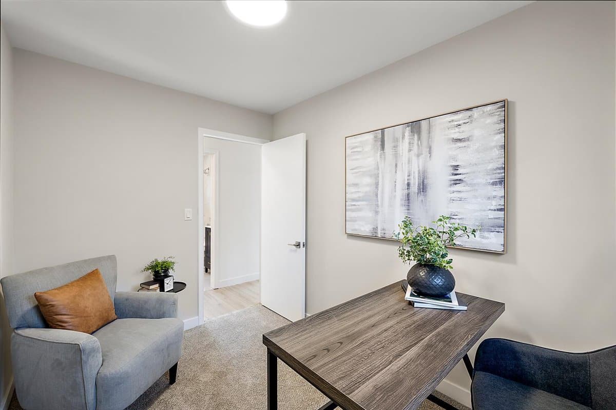 a living room filled with furniture and a flat screen tv