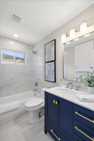 A Room With A Sink And A Mirror