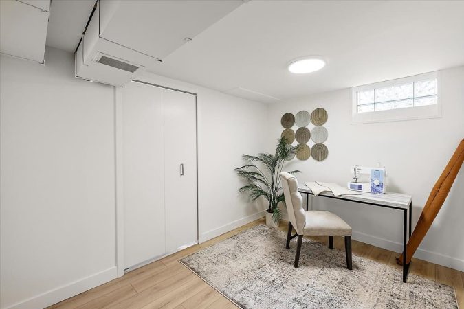 A Room Filled With Furniture And A Large Window