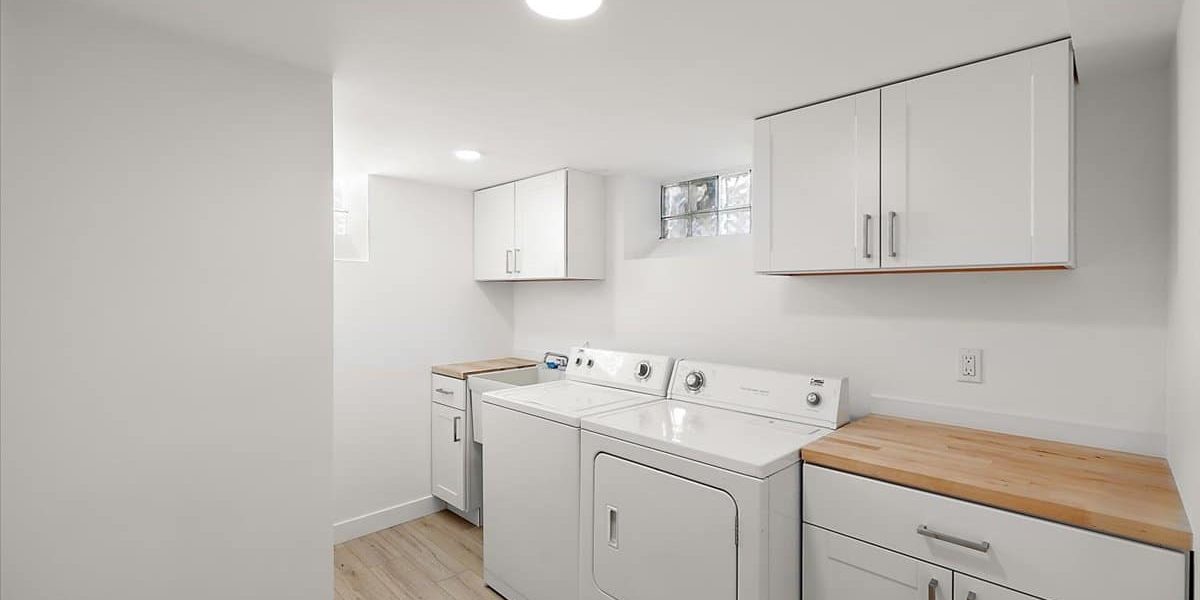 A Kitchen With A Sink And A Refrigerator