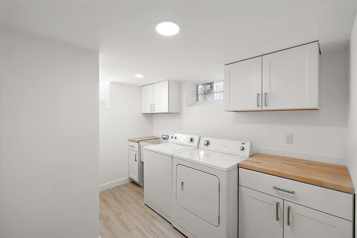 a kitchen with a sink and a refrigerator