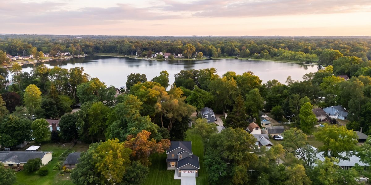 Exterior Of 1260 Round Lake Road In White Lake Township With Driveway And Round Lake In The Background
